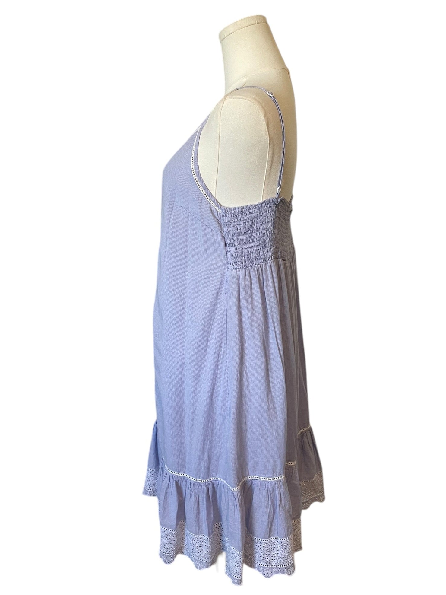Light blue dress on a mannequin against a white background