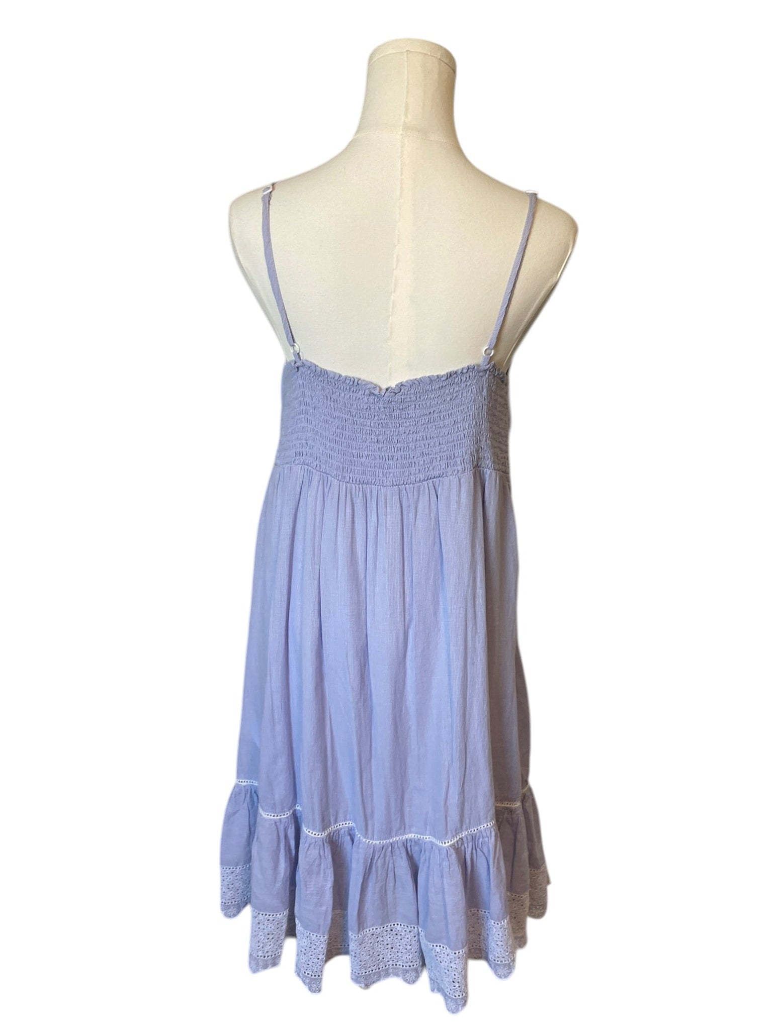 Blue dress on a mannequin against a white background