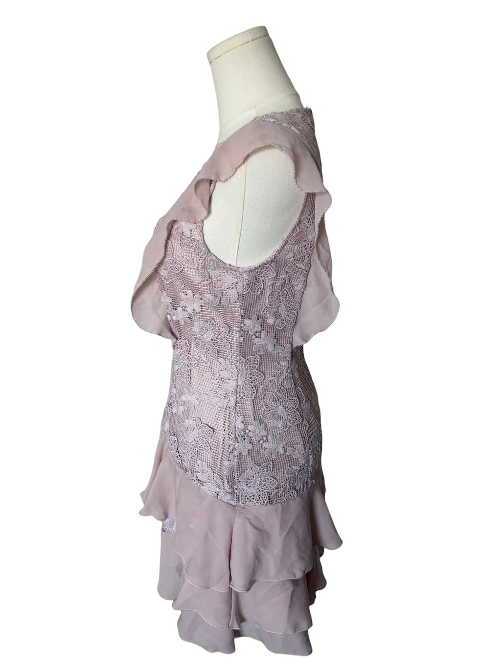 Light purple lace dress on a mannequin against a white background