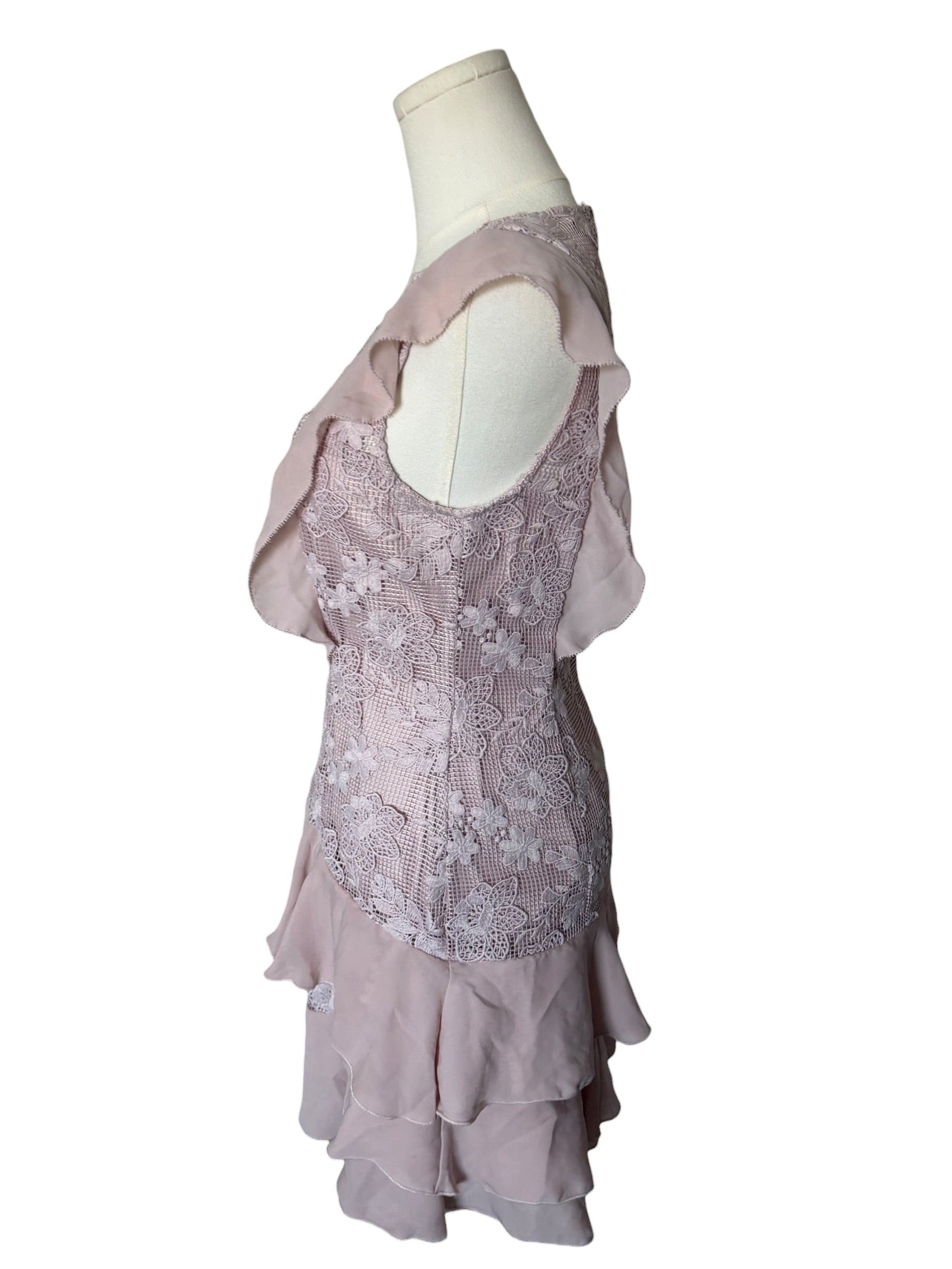 Light purple lace dress on a mannequin against a white background