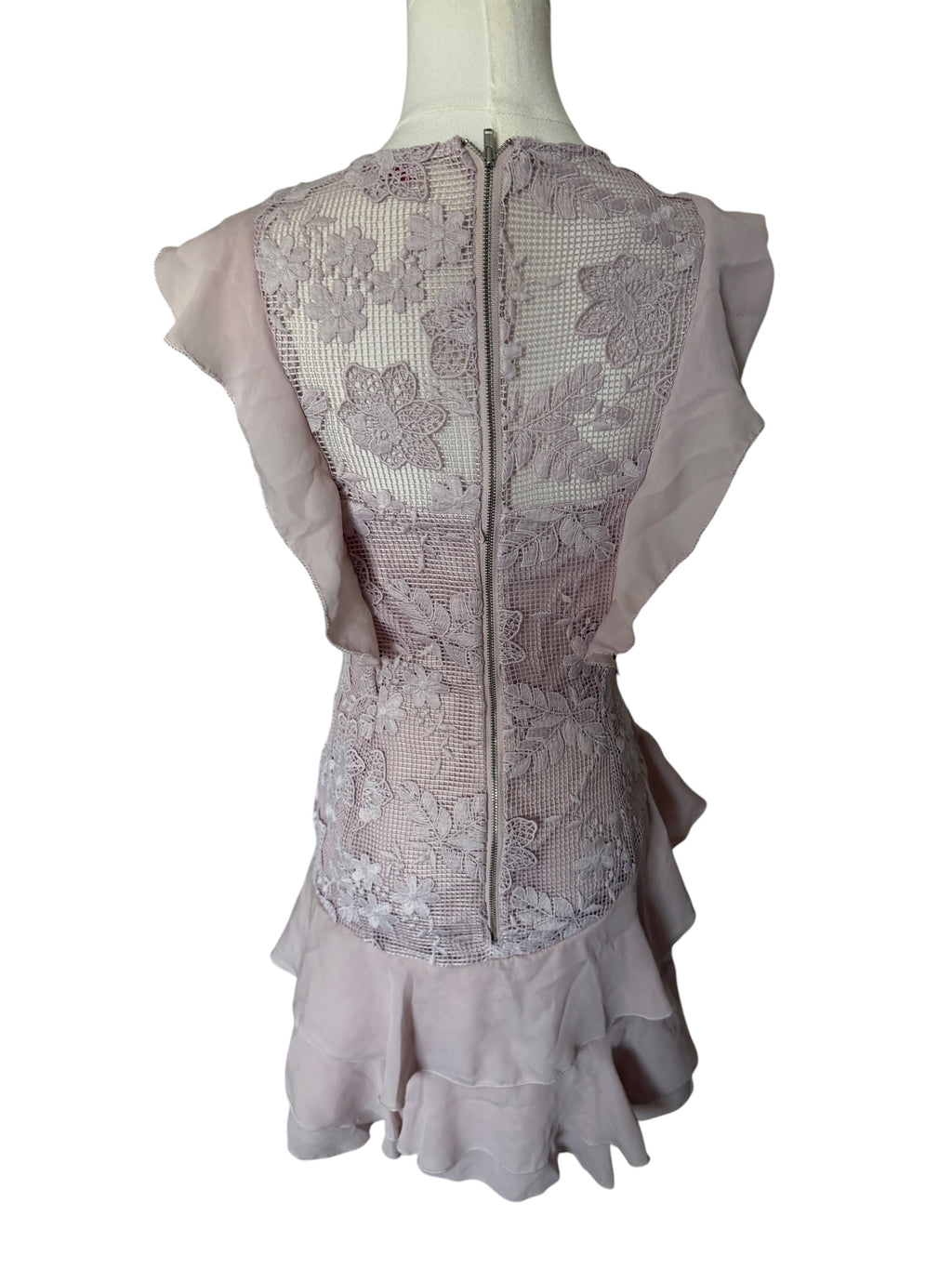 Lace dress on a mannequin with a white background