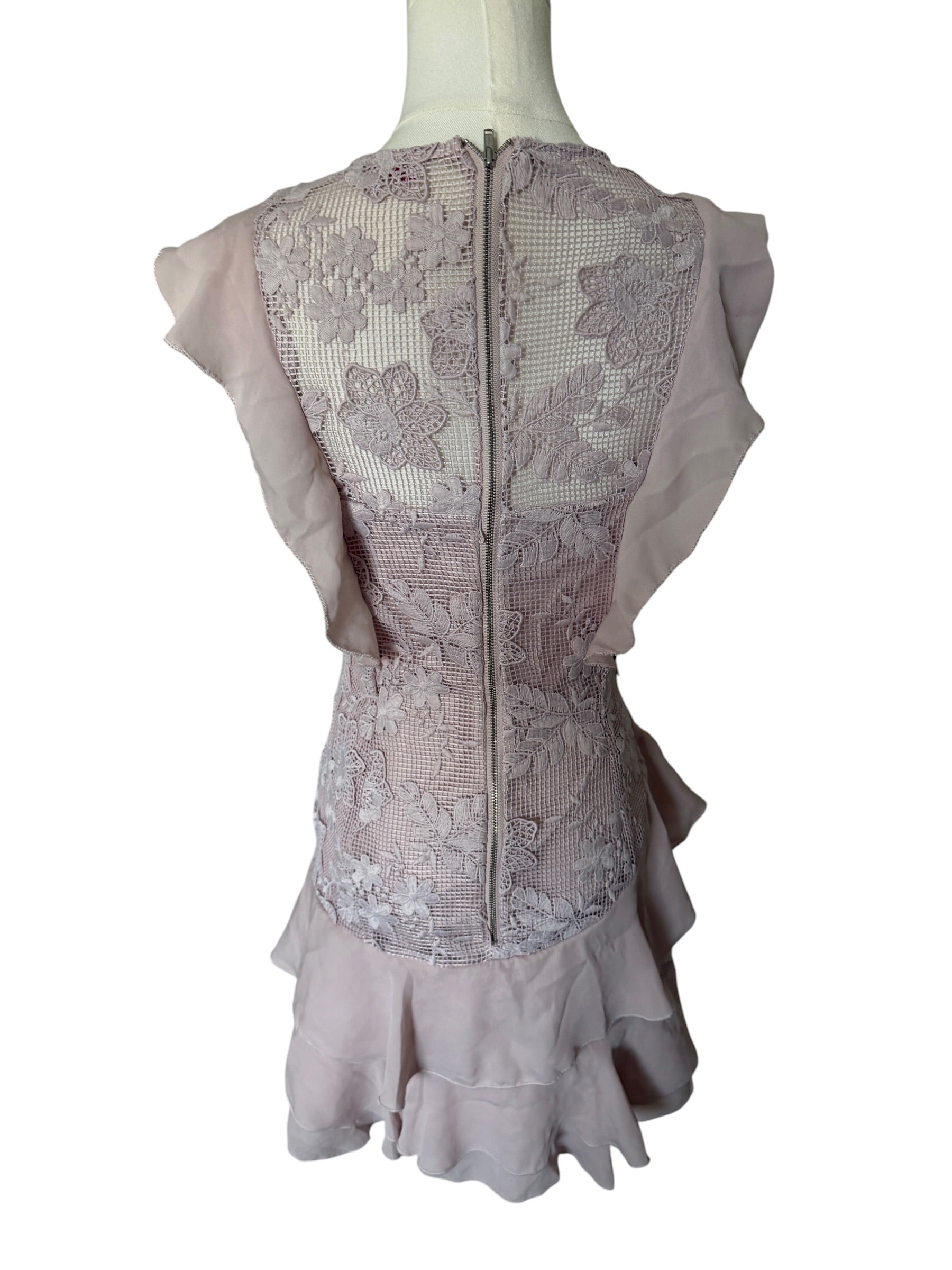 Lace dress on a mannequin with a white background