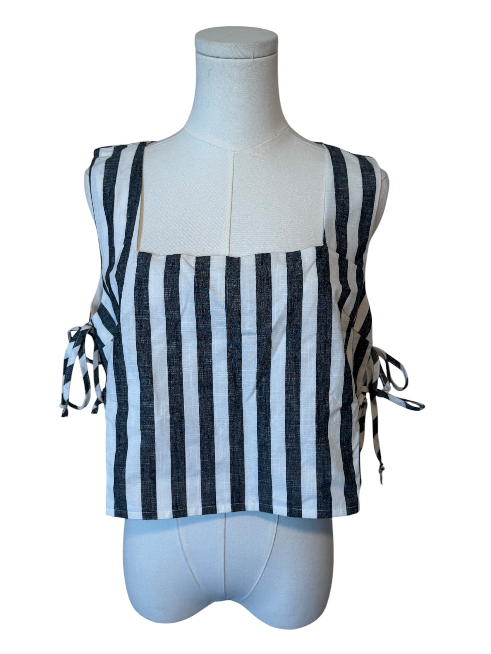 Navy and white striped top on a mannequin with a white background