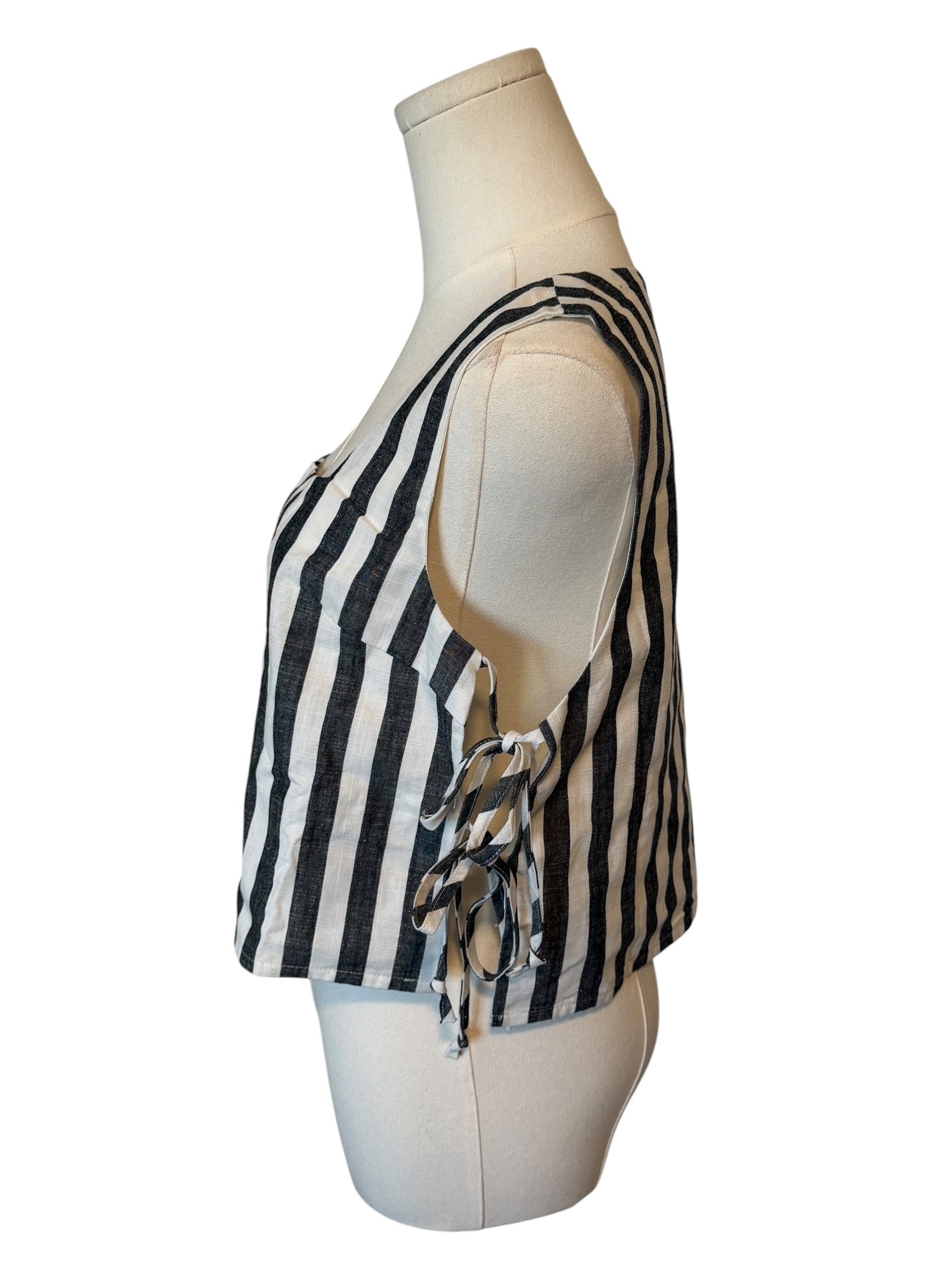 Black and white striped top on a mannequin against a white background