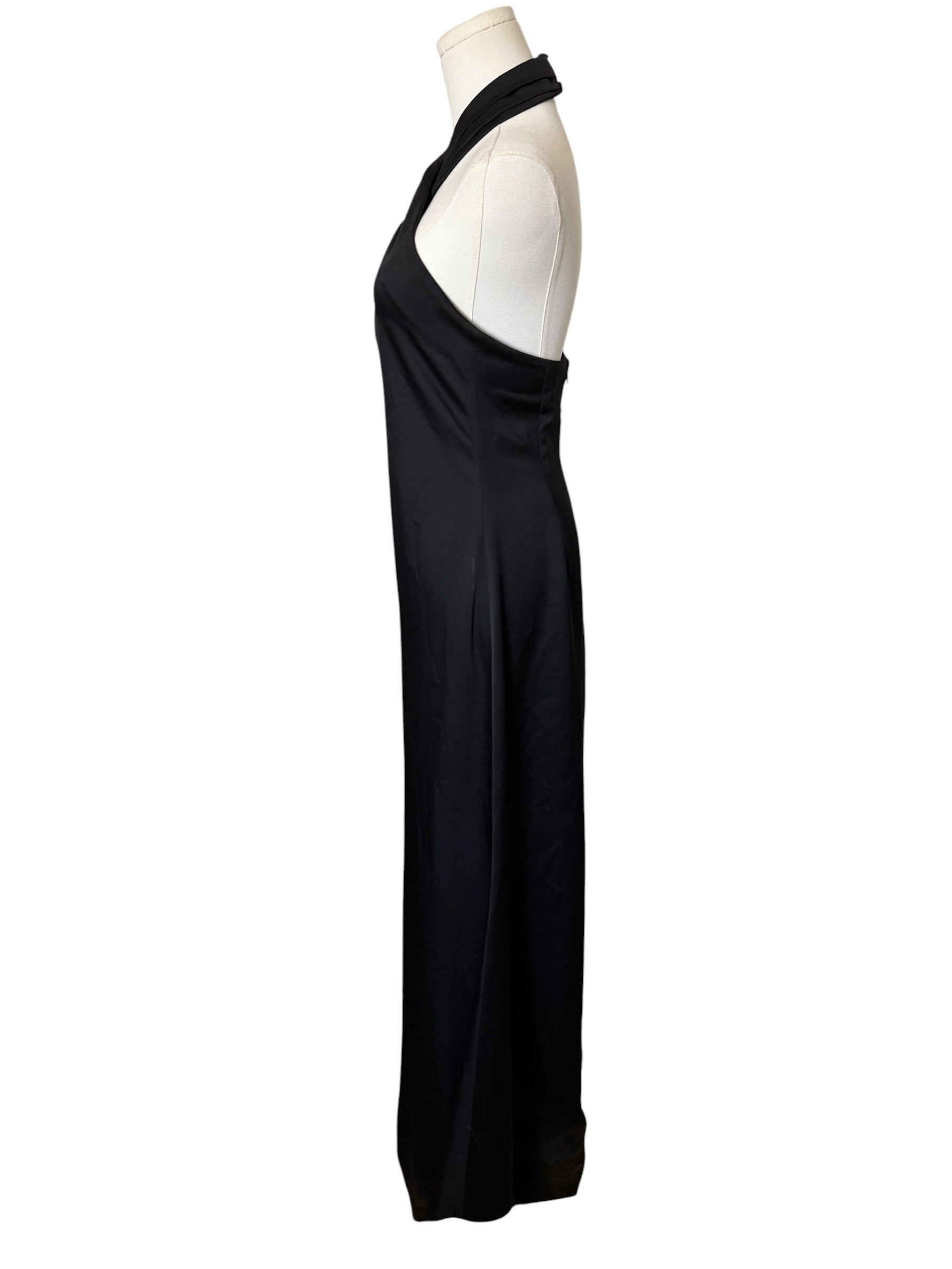 Black evening gown on a mannequin against a white background