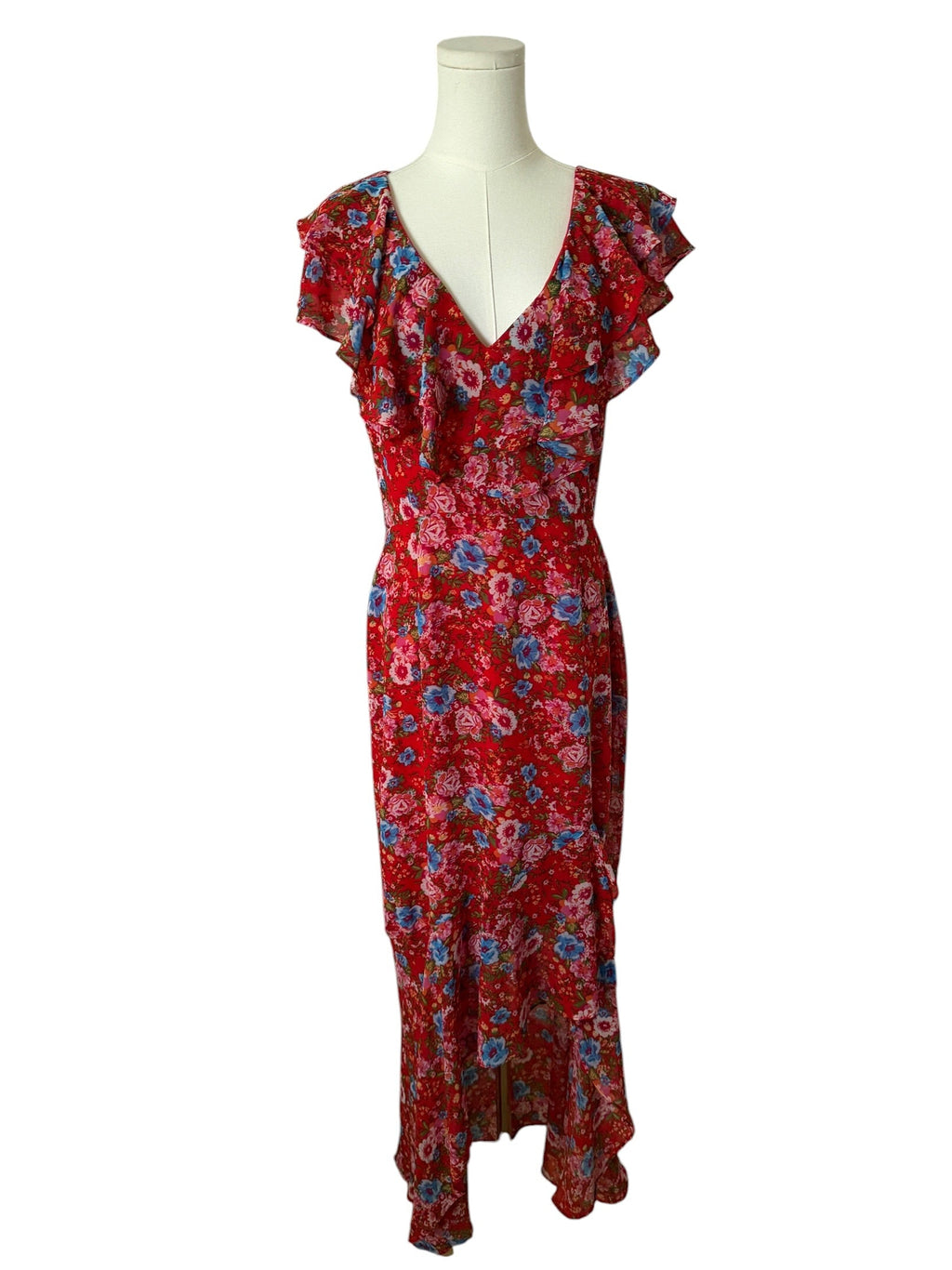 Red floral dress on a mannequin against a white background