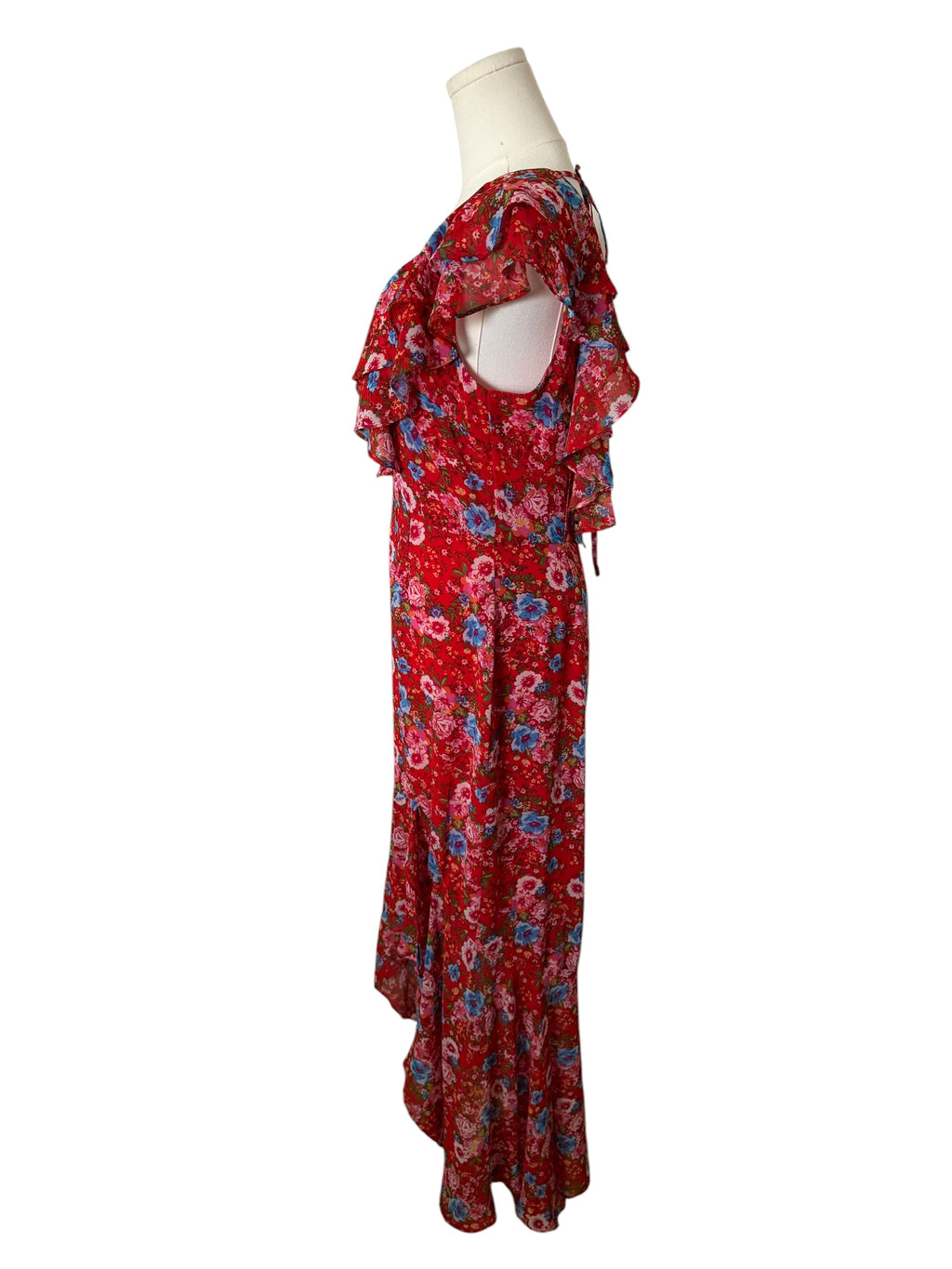 Red floral dress on a mannequin against a white background