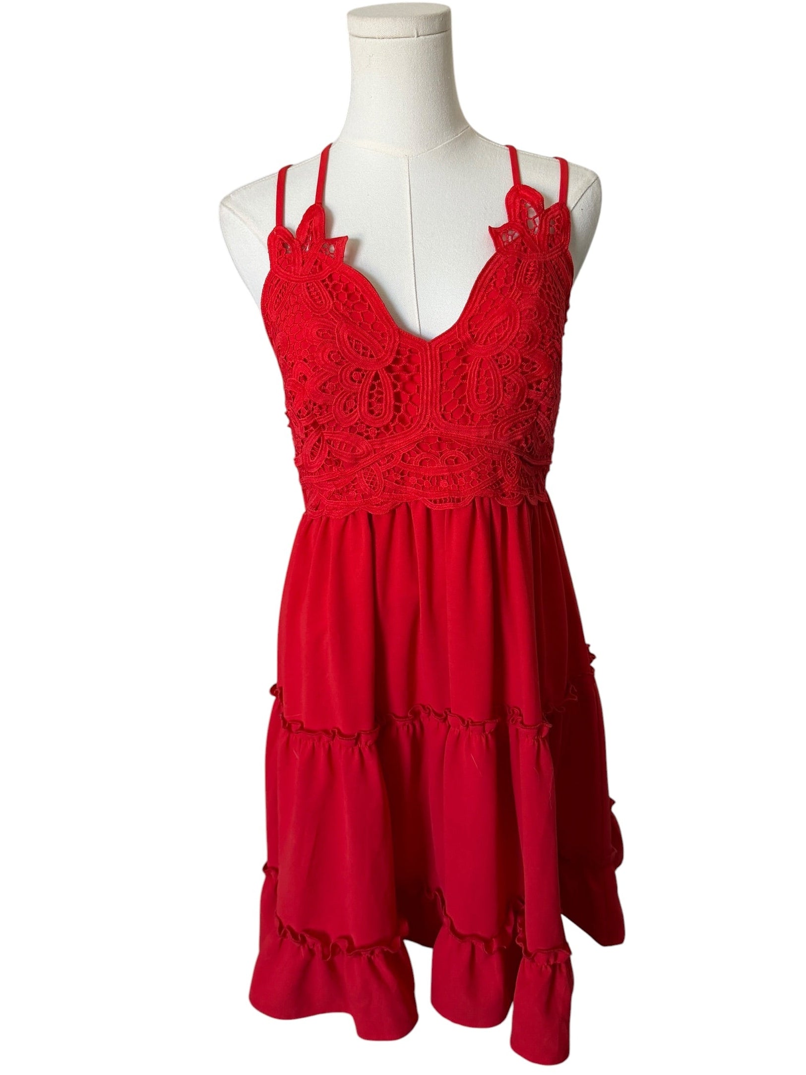 Red dress on a mannequin against a white background