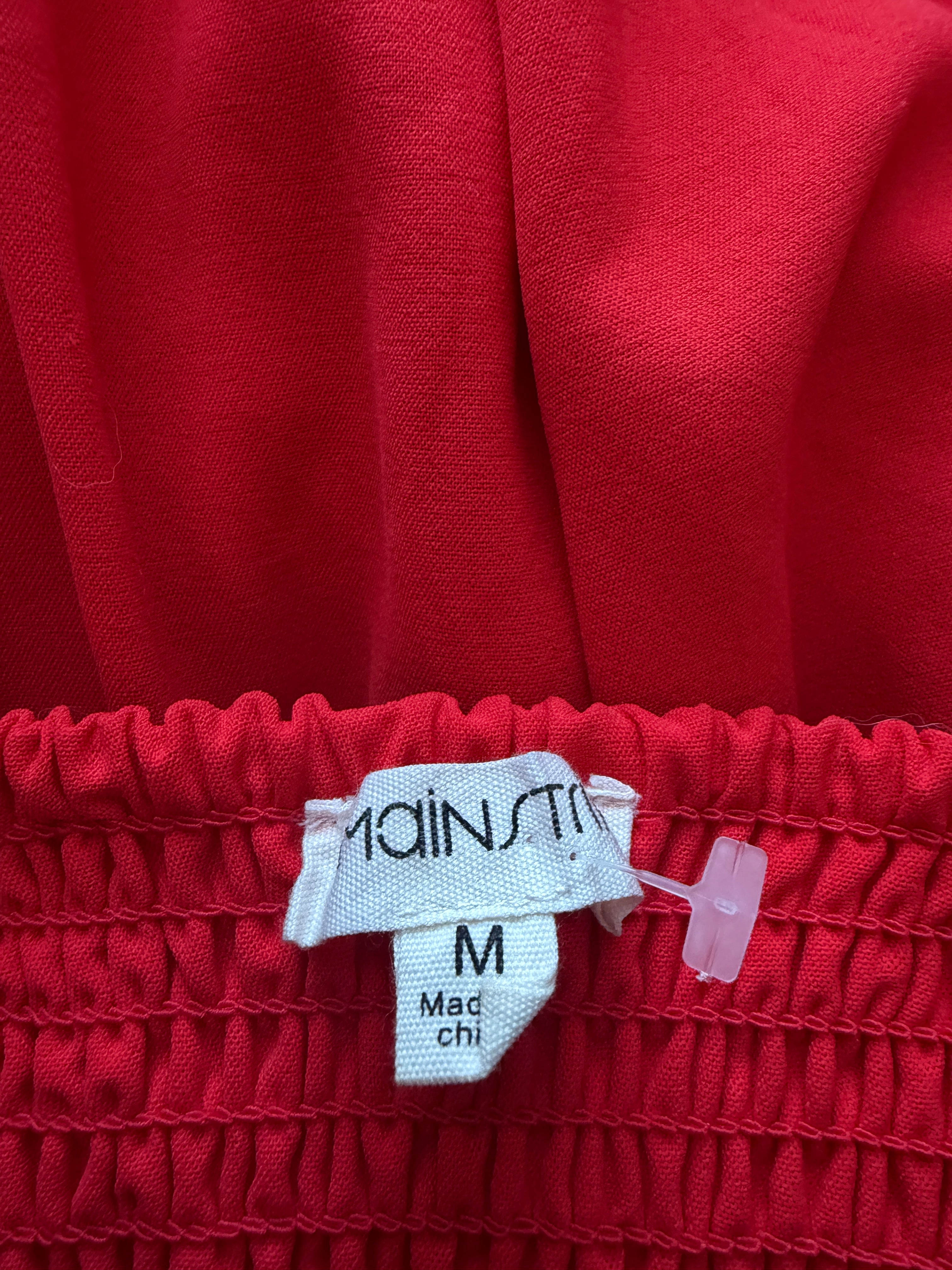 Red fabric with a visible label on a red background