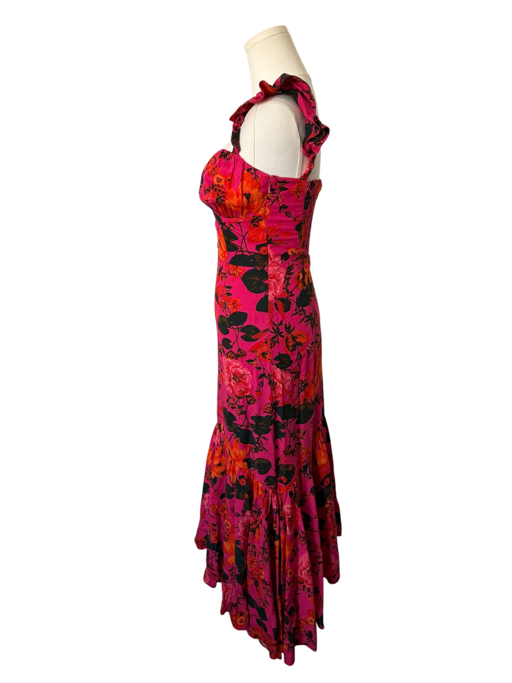 Colorful dress on a mannequin against a white background