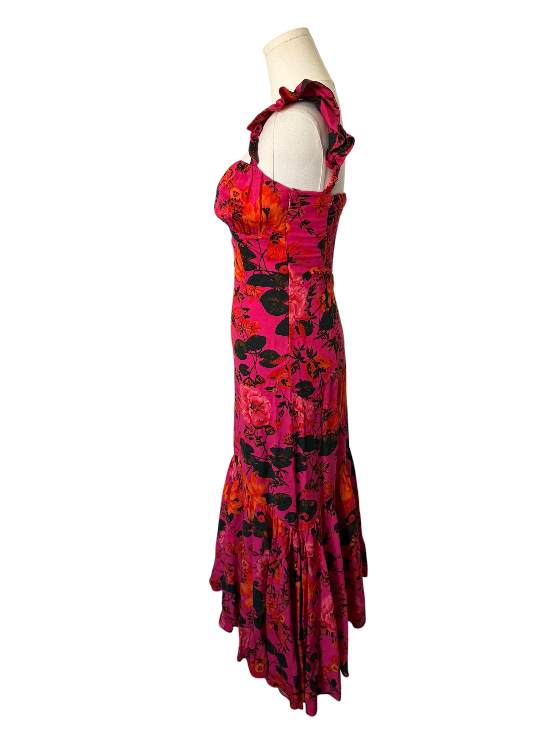Colorful dress on a mannequin against a white background