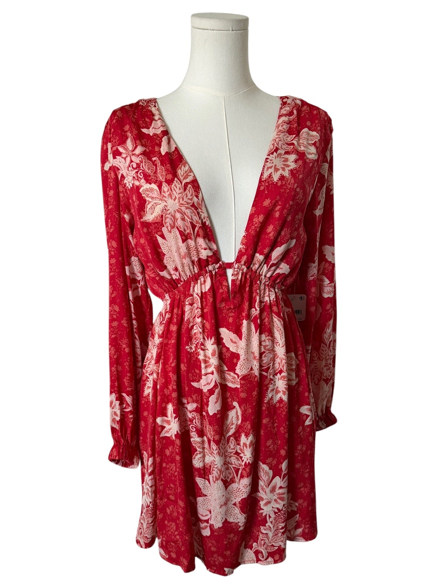 Red floral dress on a mannequin against a white background