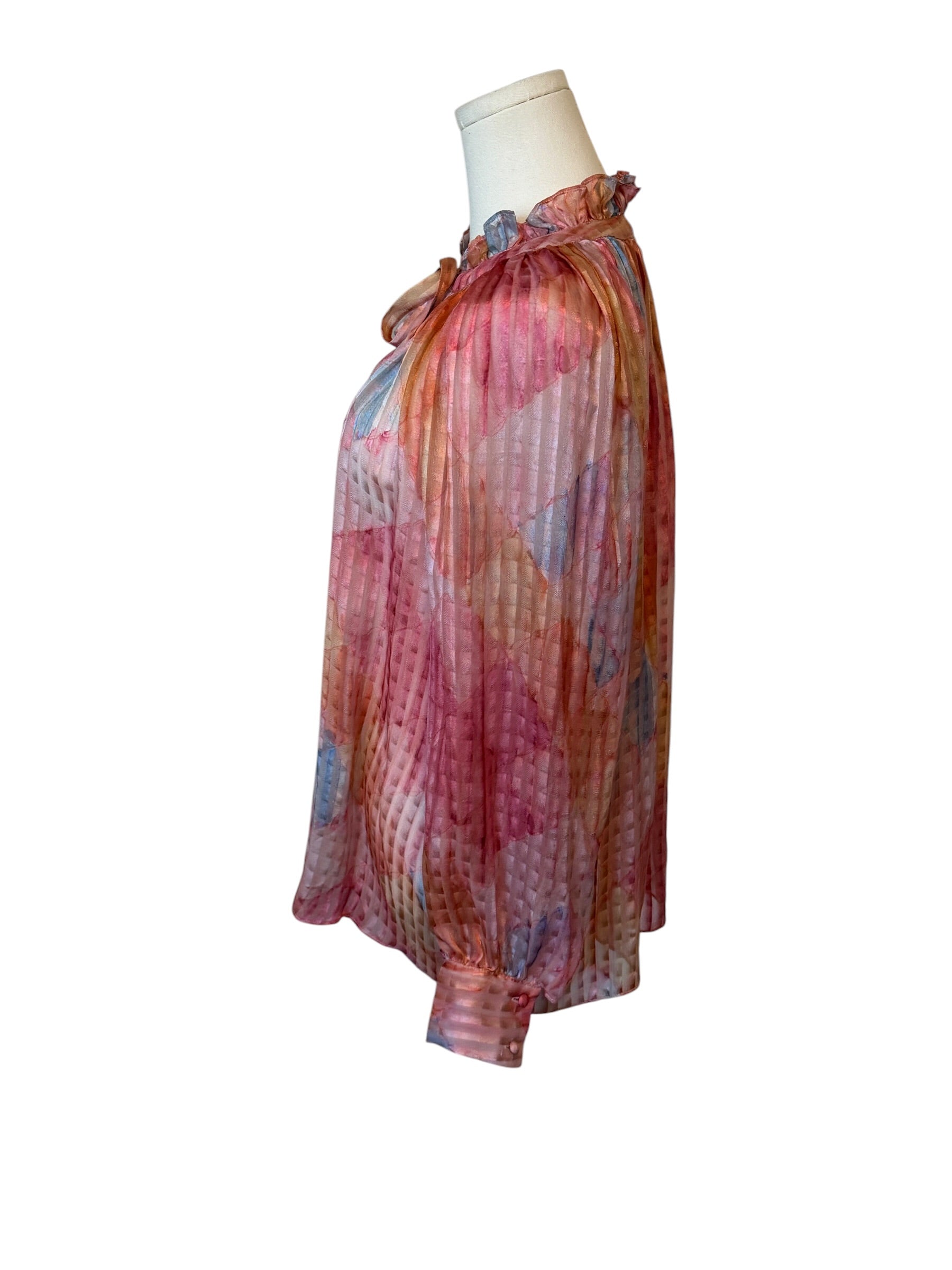 Colorful scarf on a mannequin against a white background