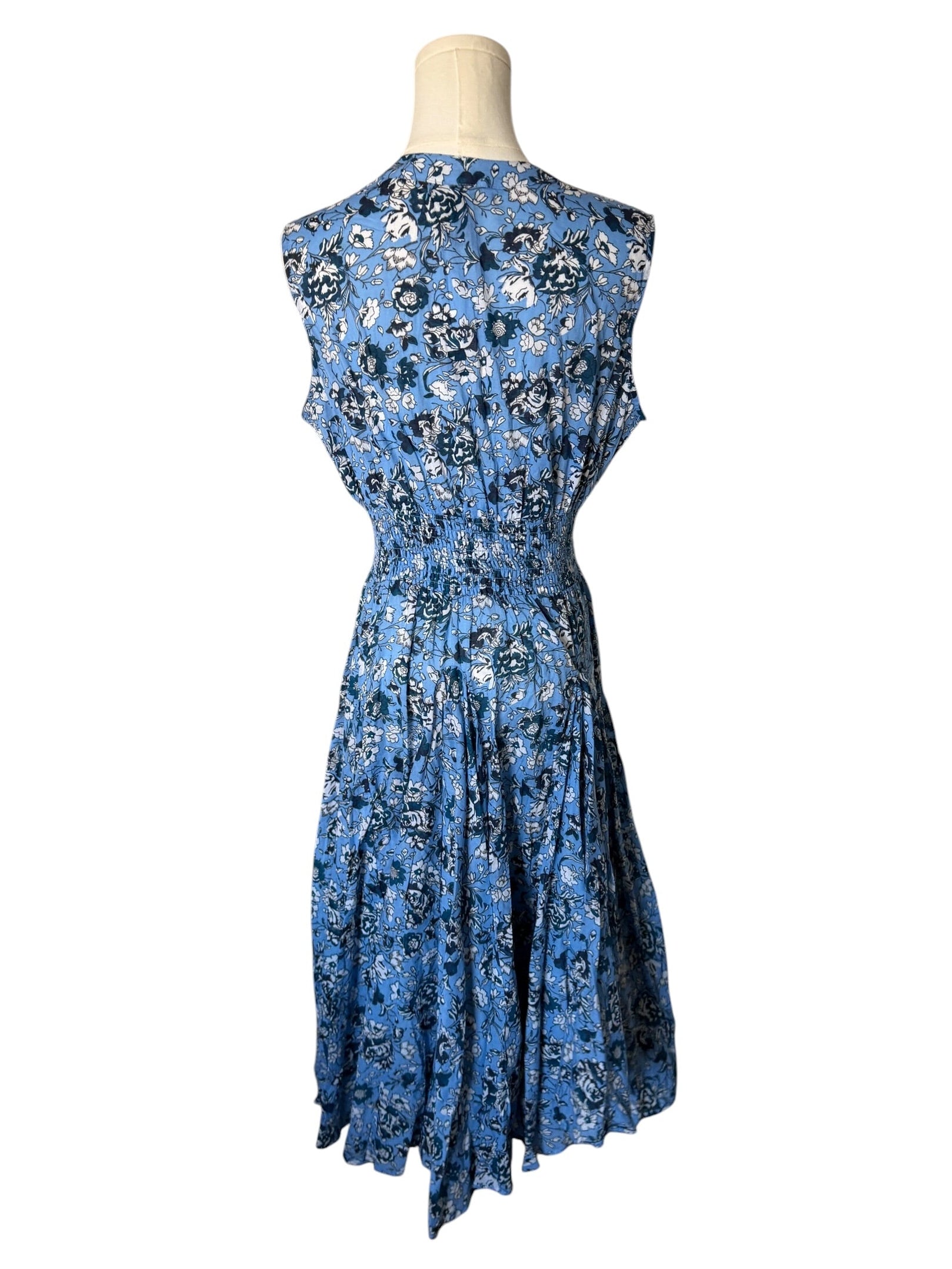 Blue floral dress on a mannequin against a white background
