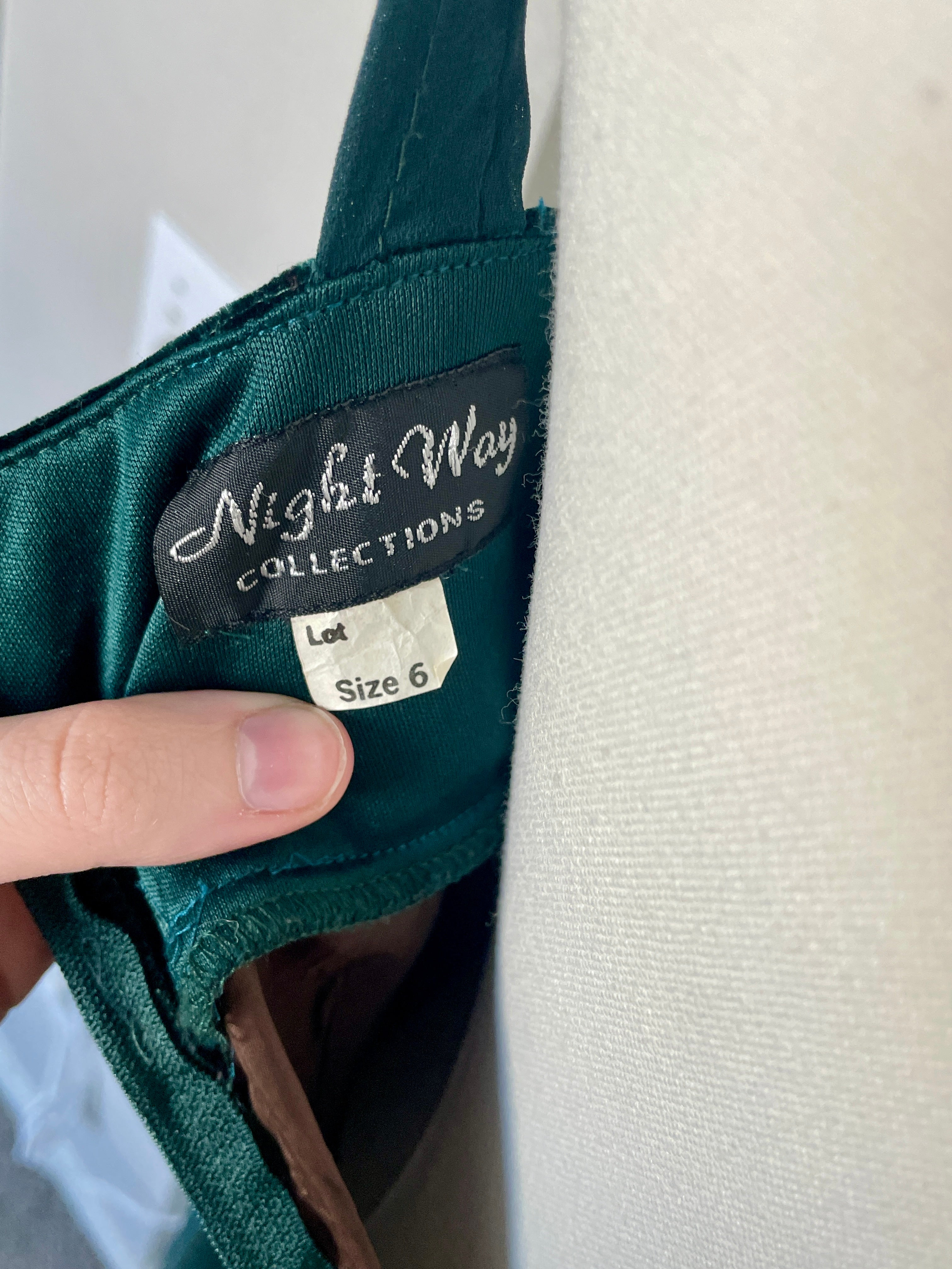 Label on a garment with 'Night Way Collections' branding