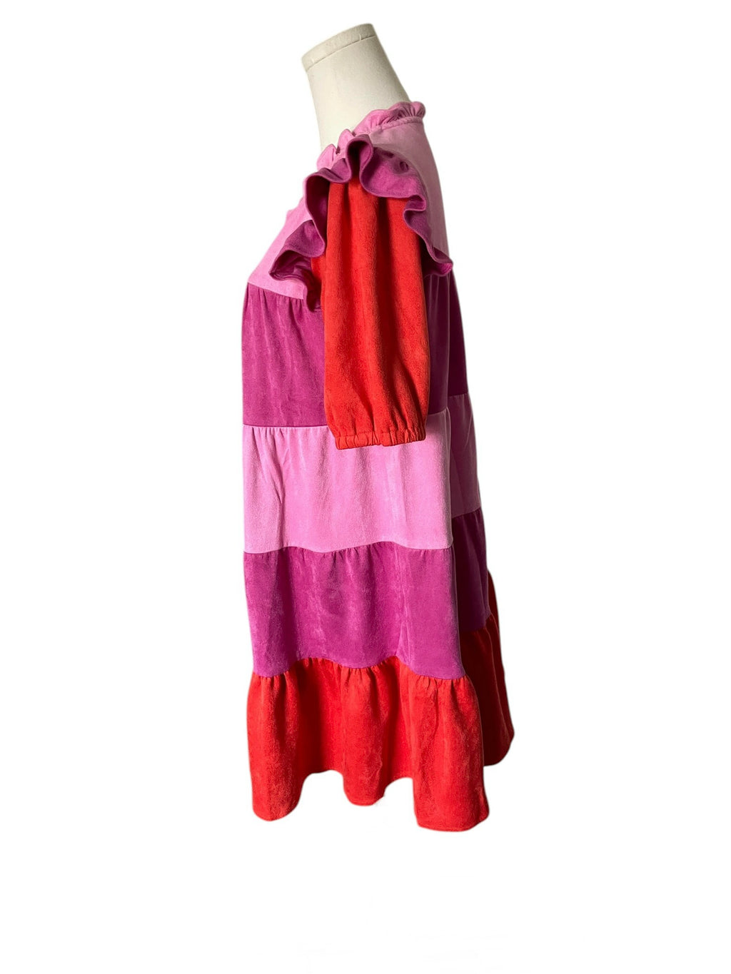 Color-blocked dress on a mannequin against a white background