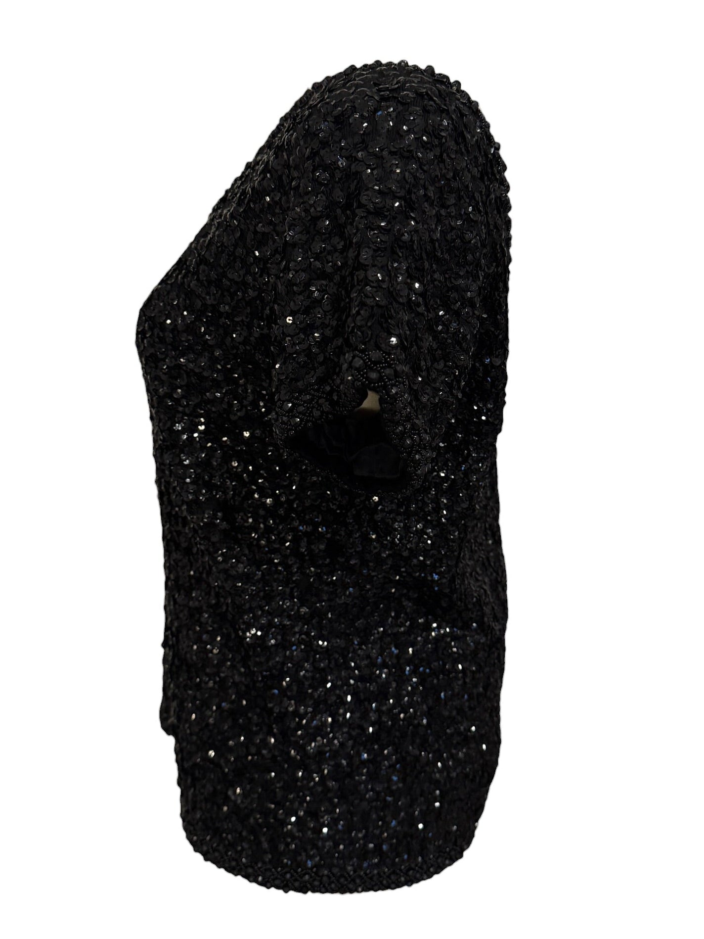 Black glittery one-shoulder top on a white background