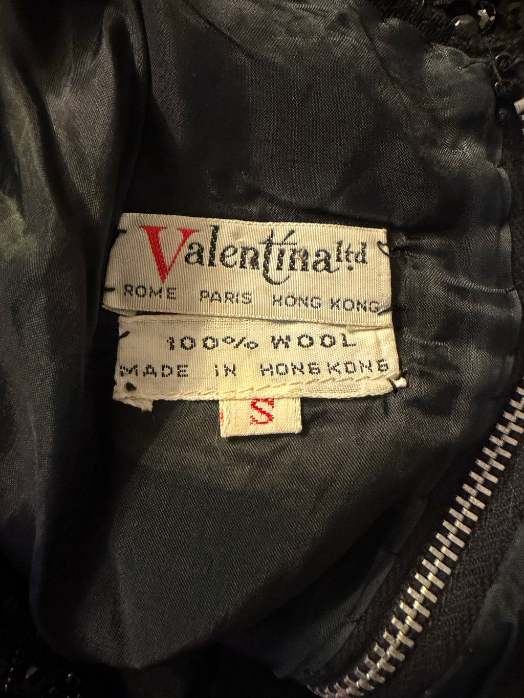 Valentina label on a garment with visible text and branding.