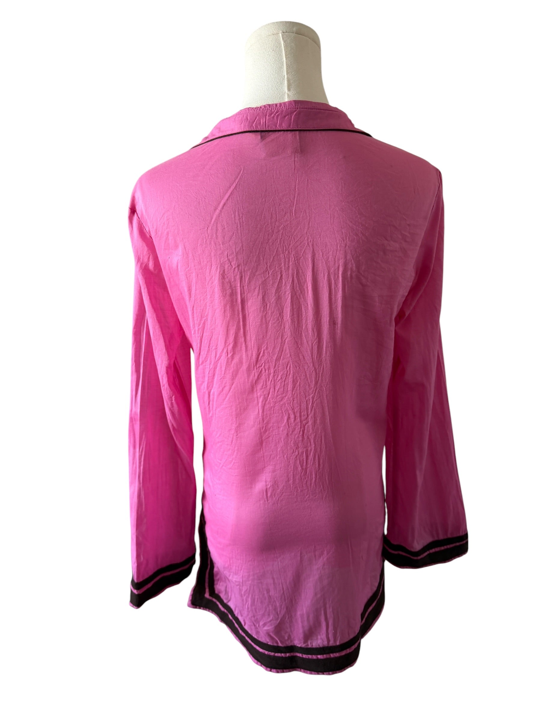 Pink shirt on a mannequin with a white background