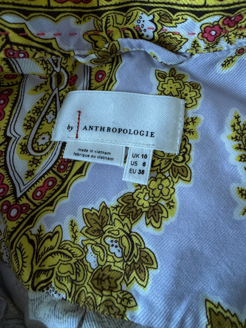 Close-up of a patterned fabric with an Anthropologie label.