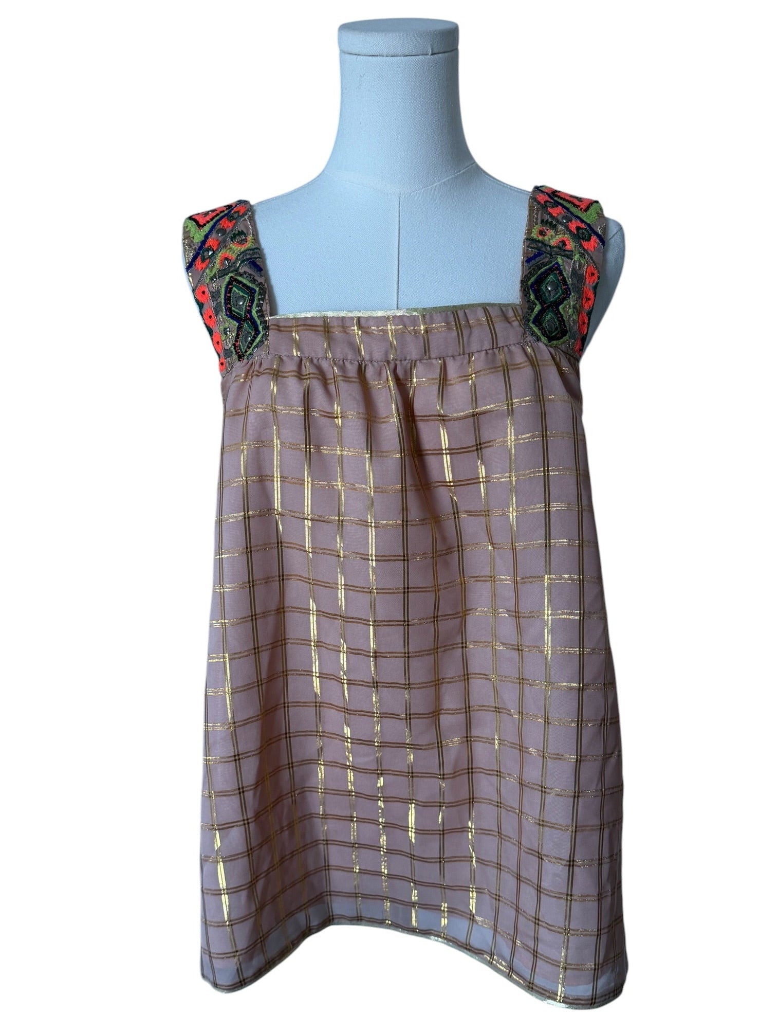 Dress on a mannequin with floral straps against a white background